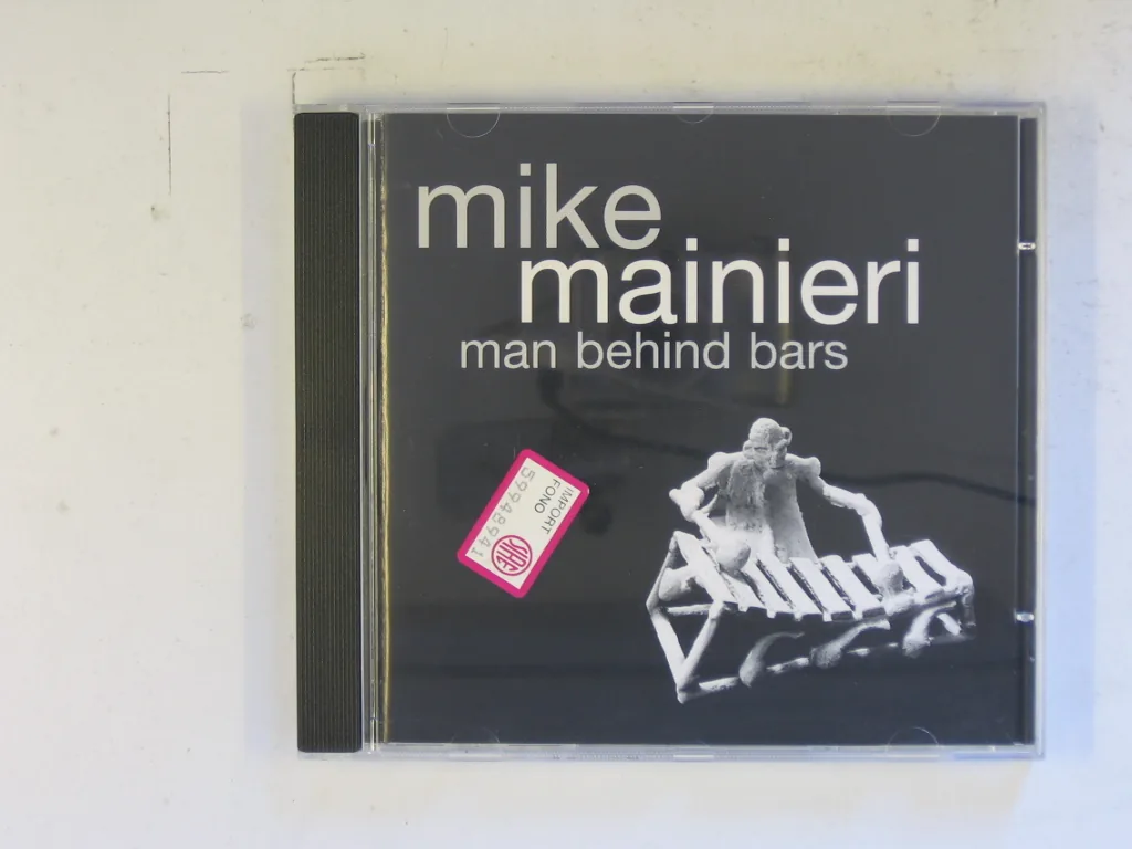 Copertina di Man Behind Bars