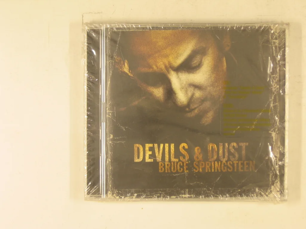 Copertina di Devils & Dust