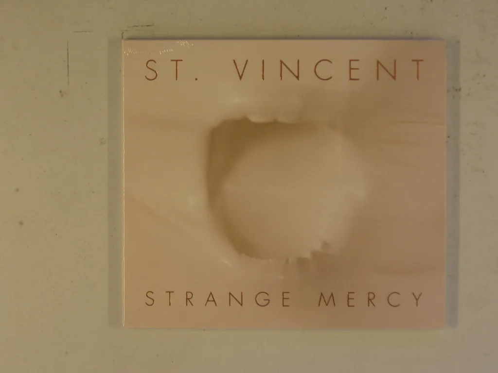 Copertina di Strange Mercy