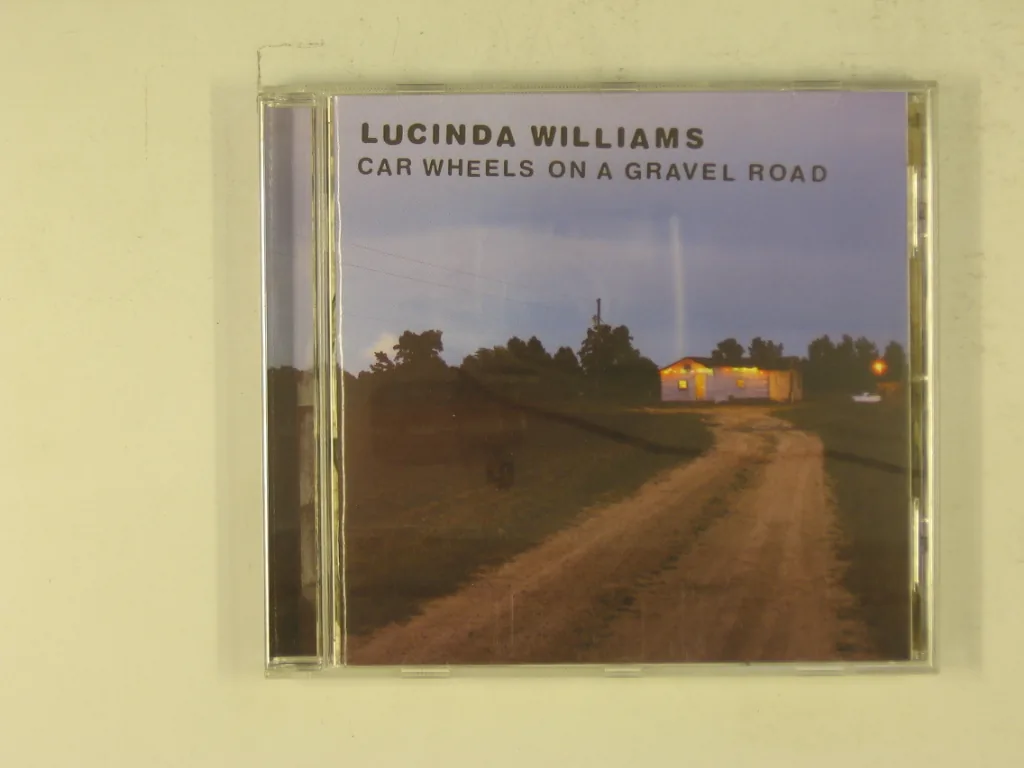 Copertina di Car Wheels On A Gravel Road