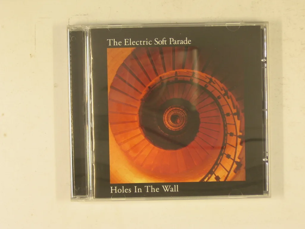 Copertina di Holes In The Wall