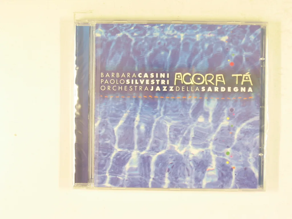 Copertina di Agora Ta
