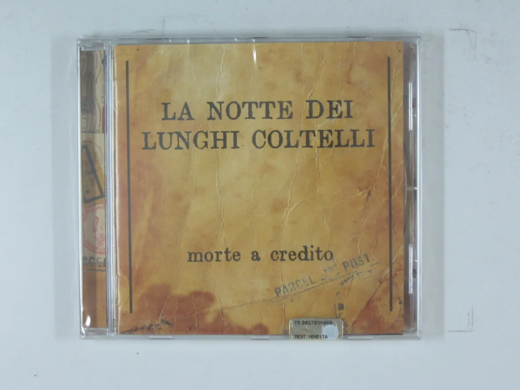 Copertina di Morte A Credito