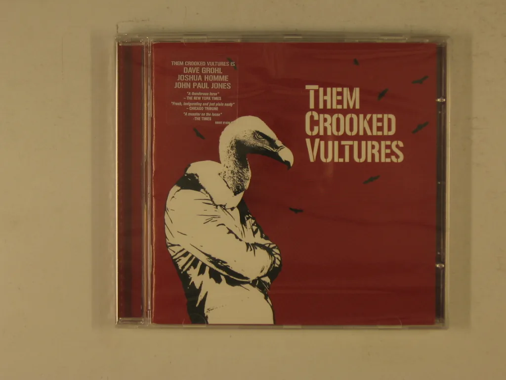 Copertina di Them Crooked Vultures